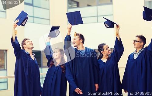 Image of group of smiling students in mortarboards