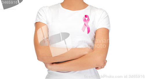 Image of smiling woman with pink cancer awareness ribbon