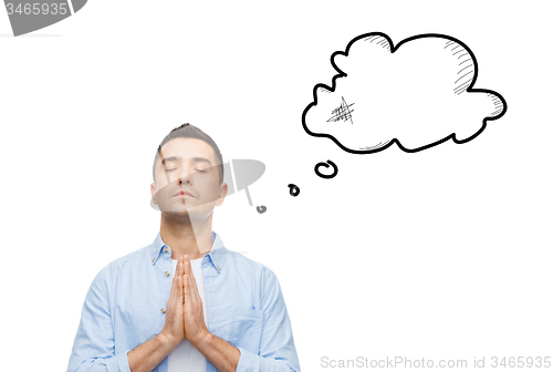 Image of man praying to god with empty text bubble doodle