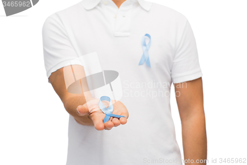 Image of hand with blue prostate cancer awareness ribbon