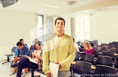 Image of group of smiling students in lecture hall