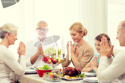 Image of smiling family having holiday dinner at home
