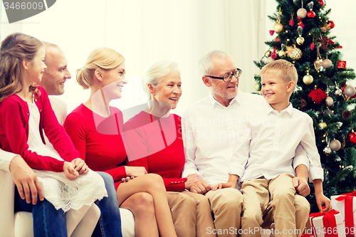 Image of smiling family at home