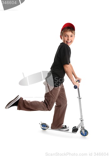 Image of Child riding a scooter