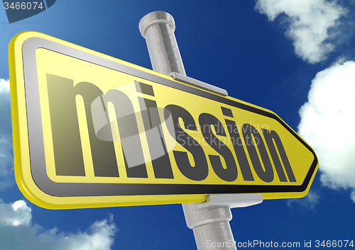Image of Yellow road sign with mission word under blue sky