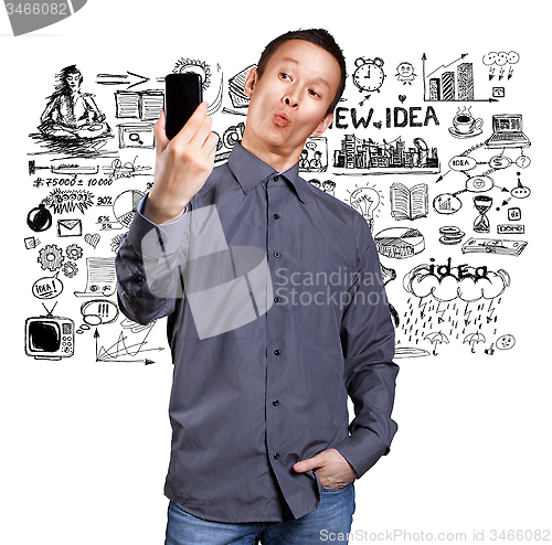 Image of Asian Man Making A Selfie