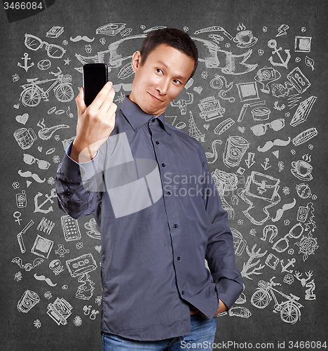 Image of Asian Man Making A Selfie