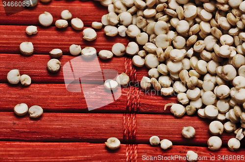 Image of Quinoa and a wooden background.