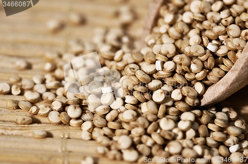 Image of Quinoa and a wooden spatula.