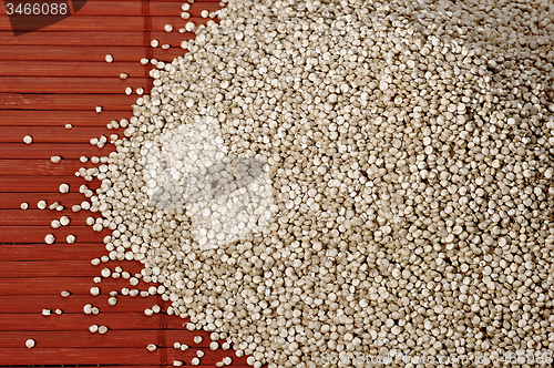 Image of Quinoa and a wooden background.