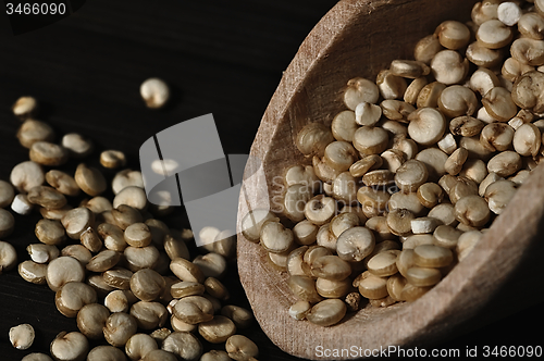 Image of Quinoa and a wooden spatula.