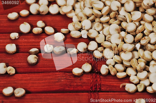 Image of Quinoa and a wooden background.