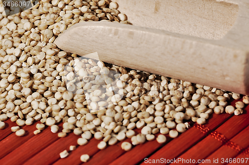 Image of Quinoa and a wooden background.