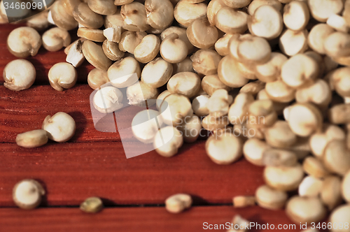 Image of Quinoa and a wooden background.