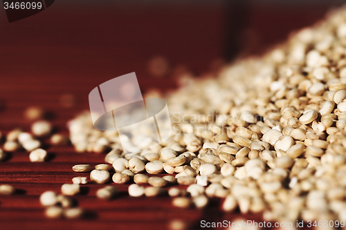 Image of Quinoa and a wooden background.