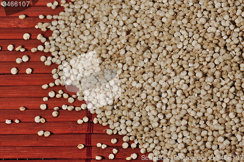 Image of Quinoa and a wooden background.