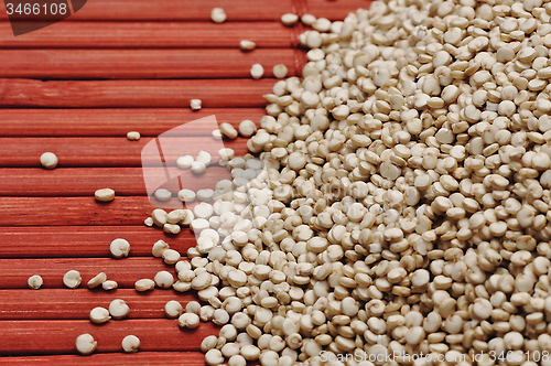 Image of Quinoa and a wooden background.