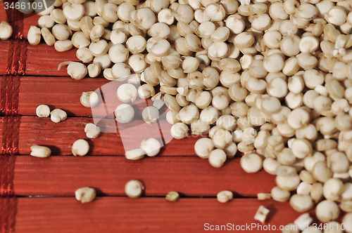 Image of Quinoa and a wooden background.