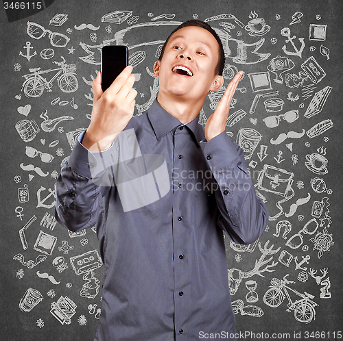 Image of Asian Man Making A Selfie