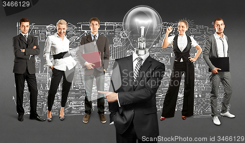 Image of Business Team With Lamp Head