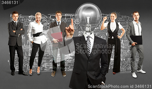 Image of Business Team With Lamp Head