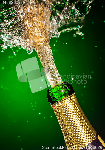 Image of Bottle of champagne with splash