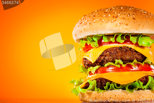 Image of Tasty and appetizing hamburger on a yellow