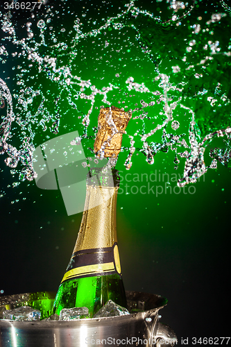 Image of Bottle of champagne with splash