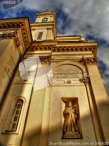 Image of Church over blue sky with moving clouds