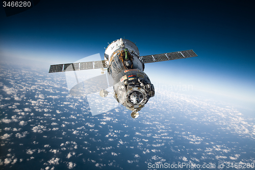 Image of Spacecraft Soyuz over the planet earth