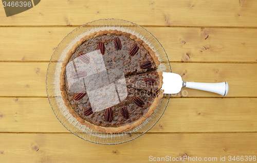 Image of Pie server with cut slice in a traditional pecan pie