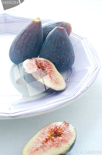Image of Group of colored figs on the colorful background