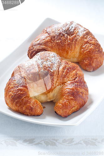 Image of Continental breakfast with coffee , croissants and fresh fruit