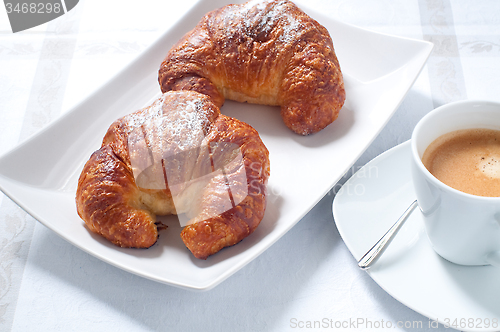 Image of Continental breakfast with coffee , croissants and fresh fruit