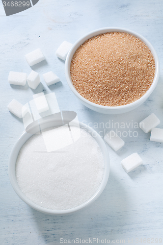 Image of Different types of sugar: brown, white and refined sugar