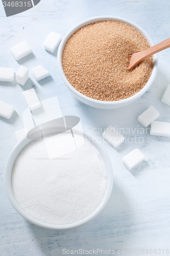 Image of Different types of sugar: brown, white and refined sugar