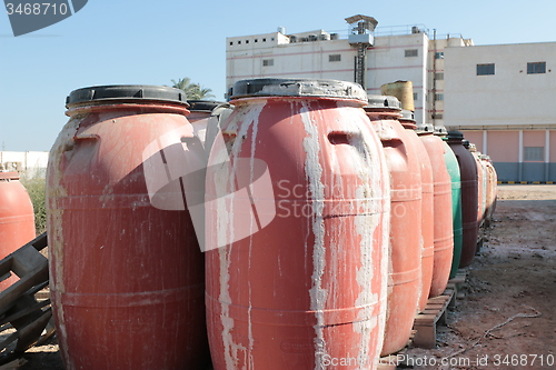 Image of Old empty plastic drums_5737