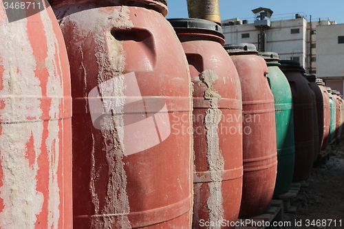 Image of Old empty plastic drums_5739