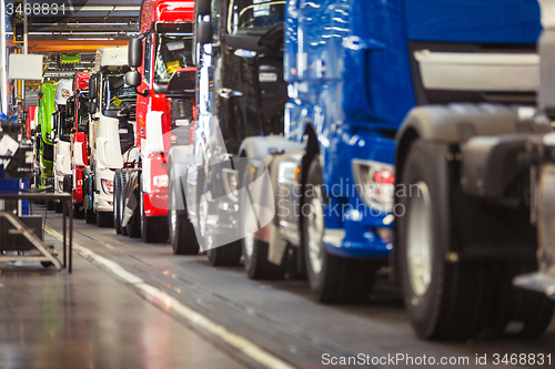 Image of Row of trucks in a production hall