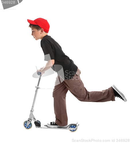 Image of Child riding a scooter toy