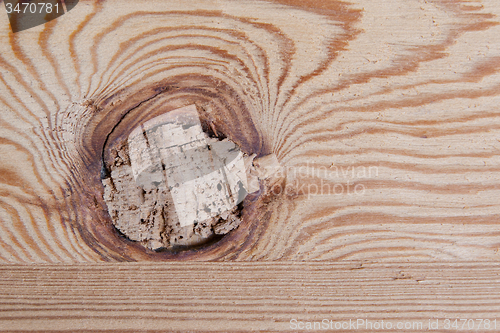 Image of Knotted wooden board close up