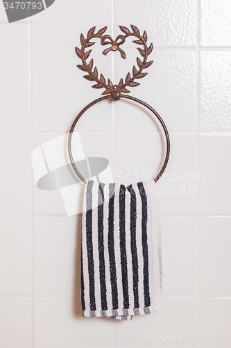 Image of Ring shaped towel holder with towel