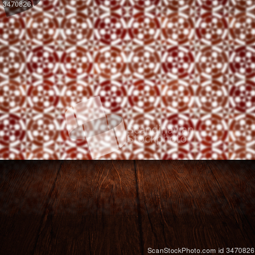 Image of Wood table top and blur vintage ceramic tile pattern wall