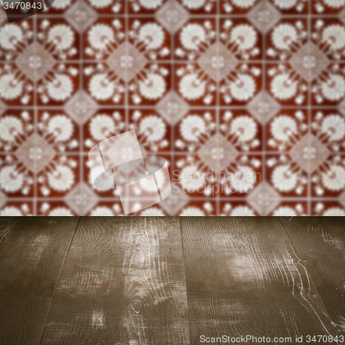 Image of Wood table top and blur vintage ceramic tile pattern wall