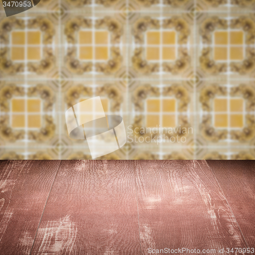 Image of Wood table top and blur vintage ceramic tile pattern wall