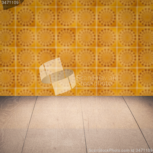 Image of Wood table top and blur vintage ceramic tile pattern wall