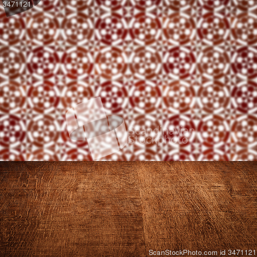 Image of Wood table top and blur vintage ceramic tile pattern wall