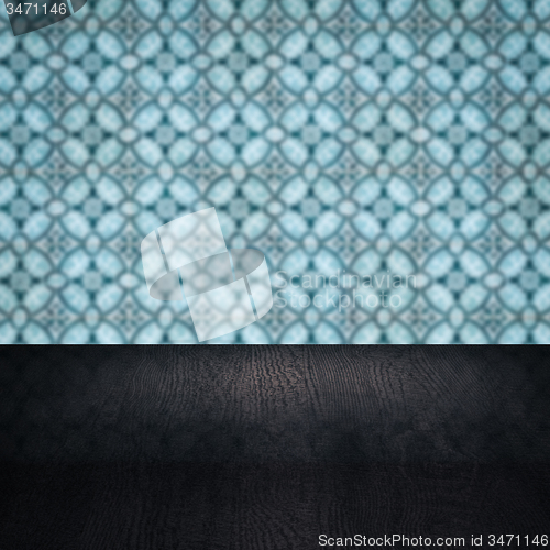 Image of Wood table top and blur vintage ceramic tile pattern wall
