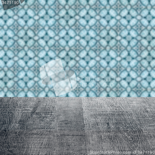 Image of Wood table top and blur vintage ceramic tile pattern wall