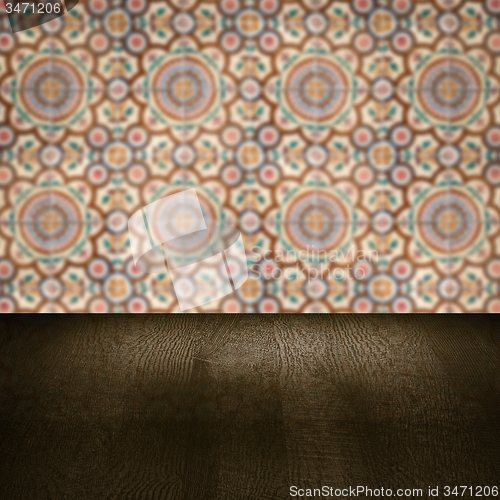 Image of Wood table top and blur vintage ceramic tile pattern wall